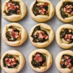 a photo of a dozen small golden brown pastries on OsuOaGfvRaOi74O4uxONAw eAk5bcaGS2yjlHRH wBR3w