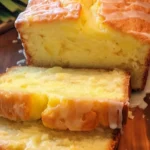 Pineapple quick bread loaf with a golden crust and pineapple pieces