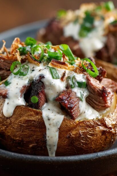Steak-Stuffed Baked Potatoes with Parmesan Cream Sauce