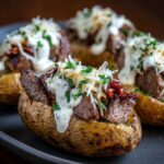 Steak-Stuffed Baked Potatoes with Parmesan Cream Sauce